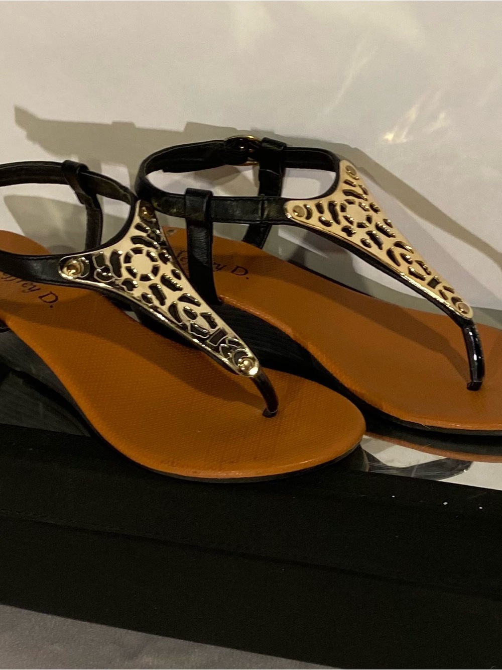 Women's Black T-Strap Sandals with Gold Accent
